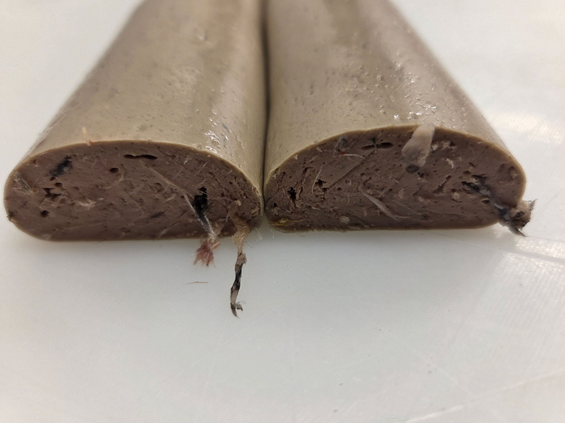 Cross-section of Norbait bait sausage showing fish material